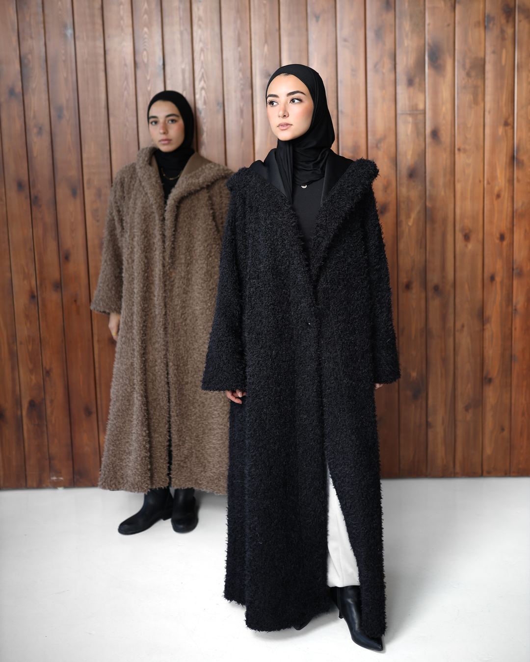 Komu Lale Winter 27 – textured long coats in black and taupe